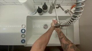 In-Home Massage Therapist Austin Wolf Washes Hands